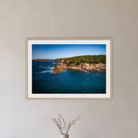 Terrace Beach framed print in oak with a white mat, in a hallway