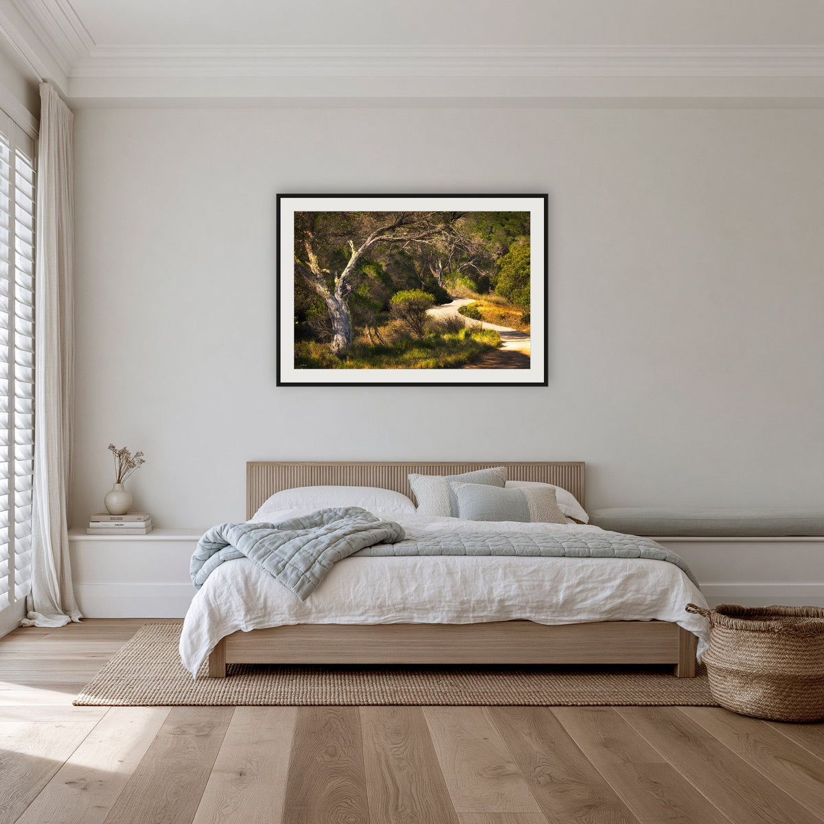 Merimbula Boardwalk framed print in black with a white mat, in a bedroom