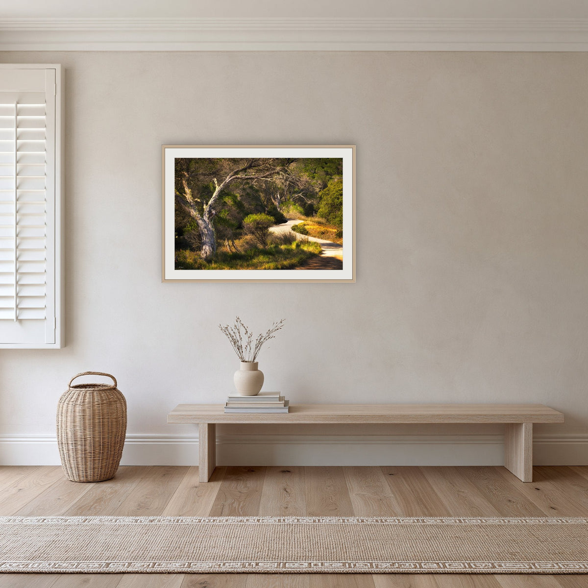 Merimbula Boardwalk framed print in oak with a white mat, in a hallway