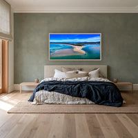 Merimbula Lake wide panorama in an oak frame above a linen bed on a sage wall — wall art, Sapphire Coast NSW