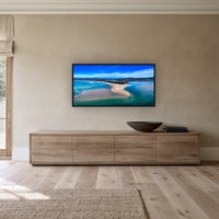 Merimbula Lake wide panorama in a black frame above a long oak sideboard — wall art, Sapphire Coast NSW