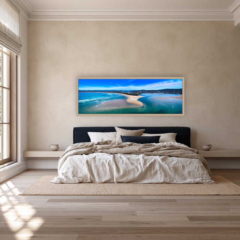 Merimbula Lake super wide panorama in an oak frame above a navy bedhead — wall art, Sapphire Coast NSW