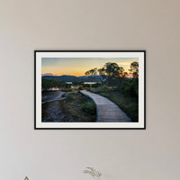 Merimbula Boardwalk — Four framed print in black with a white mat, in a hallway