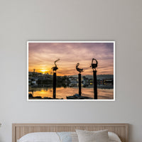 Pelican Sculptures in a white frame without a mat, on a coastal bedroom wall