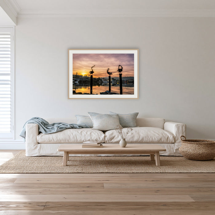 Pelican Sculptures framed print in oak with a white mat, in a lounge room
