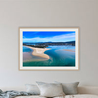 Merimbula Lake and Coastline framed print in oak with a white mat, in a lounge room