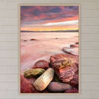 Sunset from Merimbula Wharf in an oak frame without a mat, above the bed in a white coastal bedroom