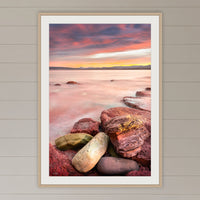 Sunset from Merimbula Wharf framed print in oak with a white mat, on a coastal lounge room wall
