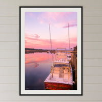 Miss Behavin framed print in black with a white mat, in a coastal bedroom