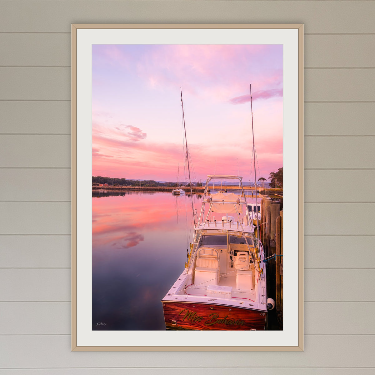 Miss Behavin framed print in oak with a white mat, in a coastal lounge room