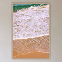 Tura Headlands in an oak frame without a mat, in a cane-panelled hallway
