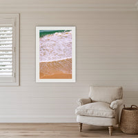 Tura Headlands framed print in white with a mat, in a coastal lounge room