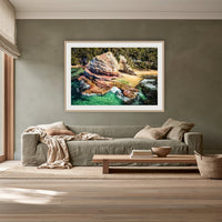 Aslings Beach Rock Pool framed print in oak with a white mat, above a sage linen sofa in a lounge room