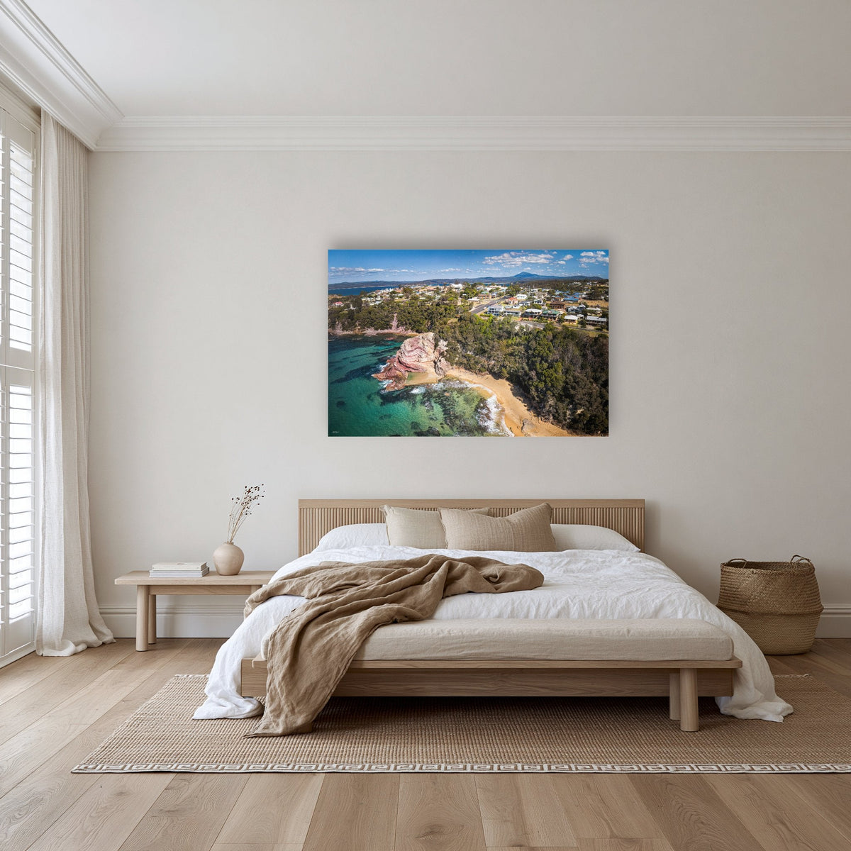 Aslings Beach from the Air acrylic panel wall art in a warm-toned bedroom