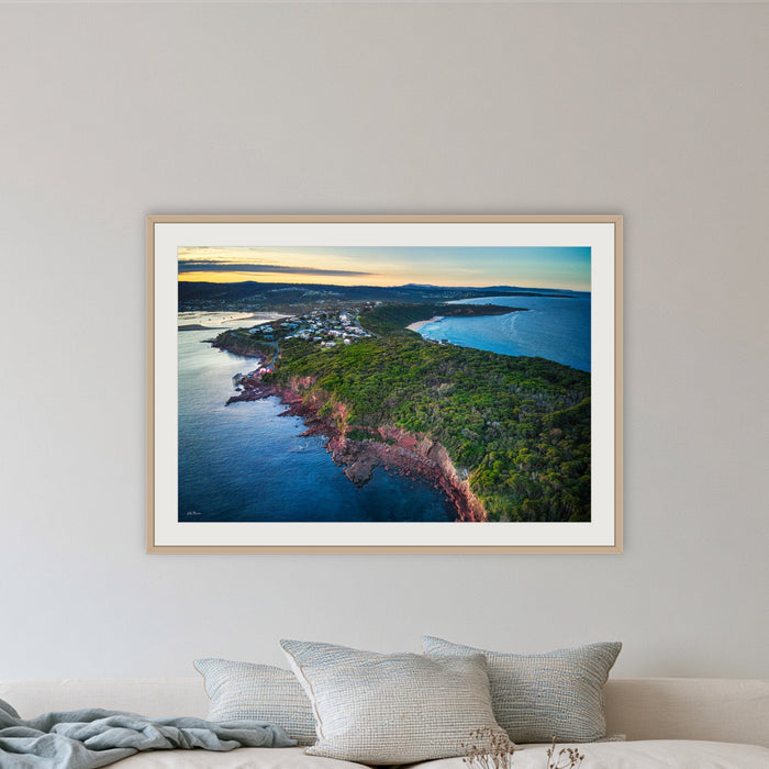 Long Point framed print in oak with a white mat, in a lounge room