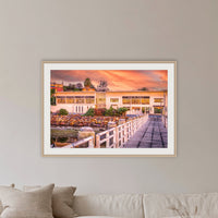 Lakeview Hotel framed print in oak with a white mat, in a lounge room