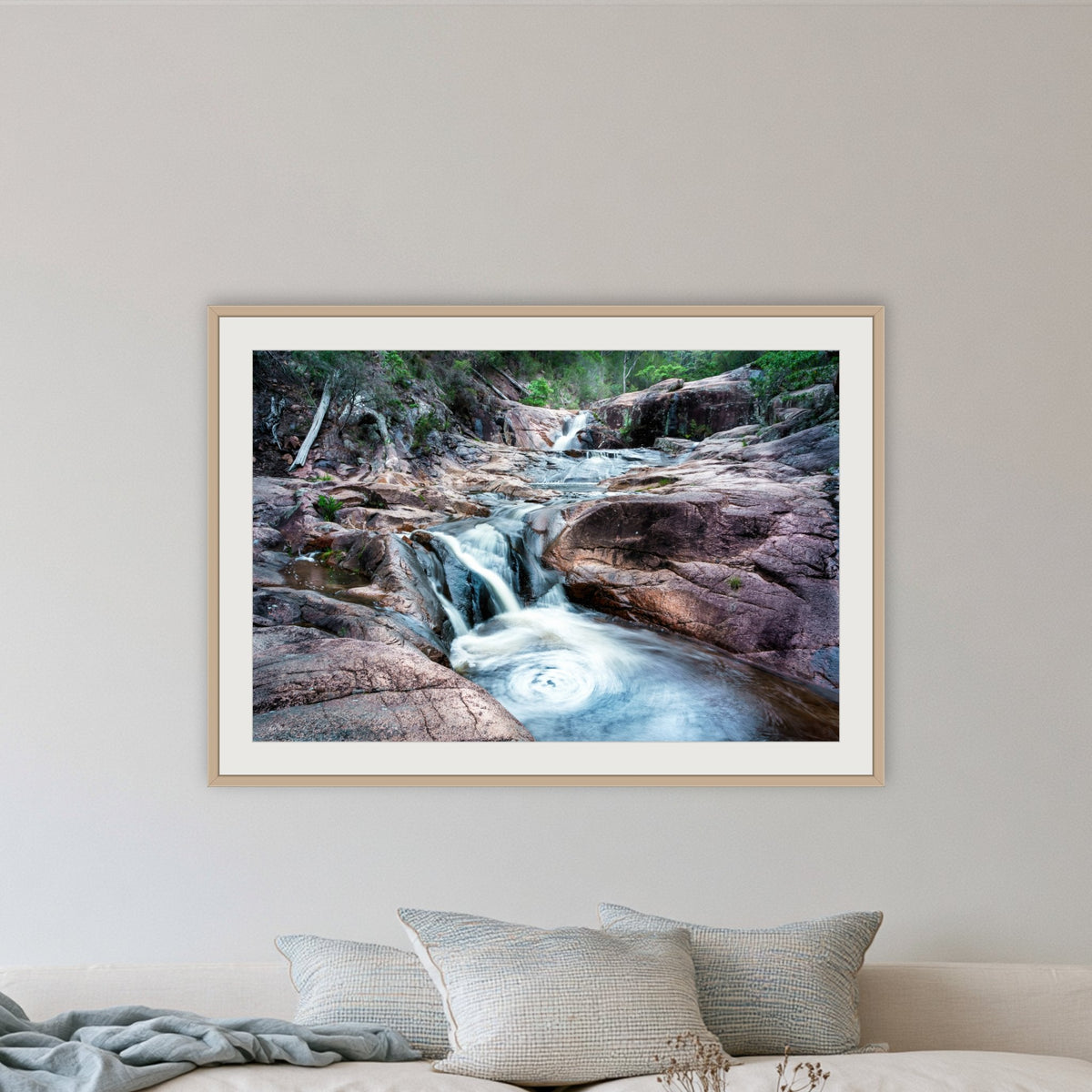 Biamanga Cultural Area framed print in oak with a white mat, in a lounge room