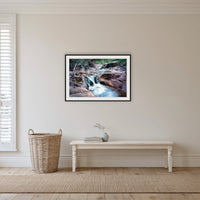Biamanga Cultural Area framed print in black with a white mat, in a hallway