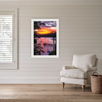 Cattle Bay framed print in white with a mat, in a coastal lounge room