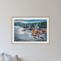 North Head Worang Point framed print in oak with a white mat, in a lounge room