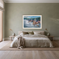 North Head Worang Point framed print in oak with a white mat, above a linen bed against a sage wall in a bedroom