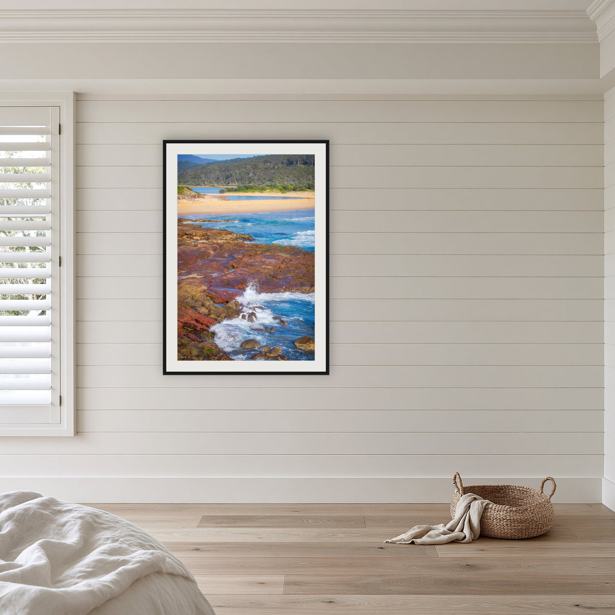 Short Point framed print in black with a white mat, in a coastal bedroom