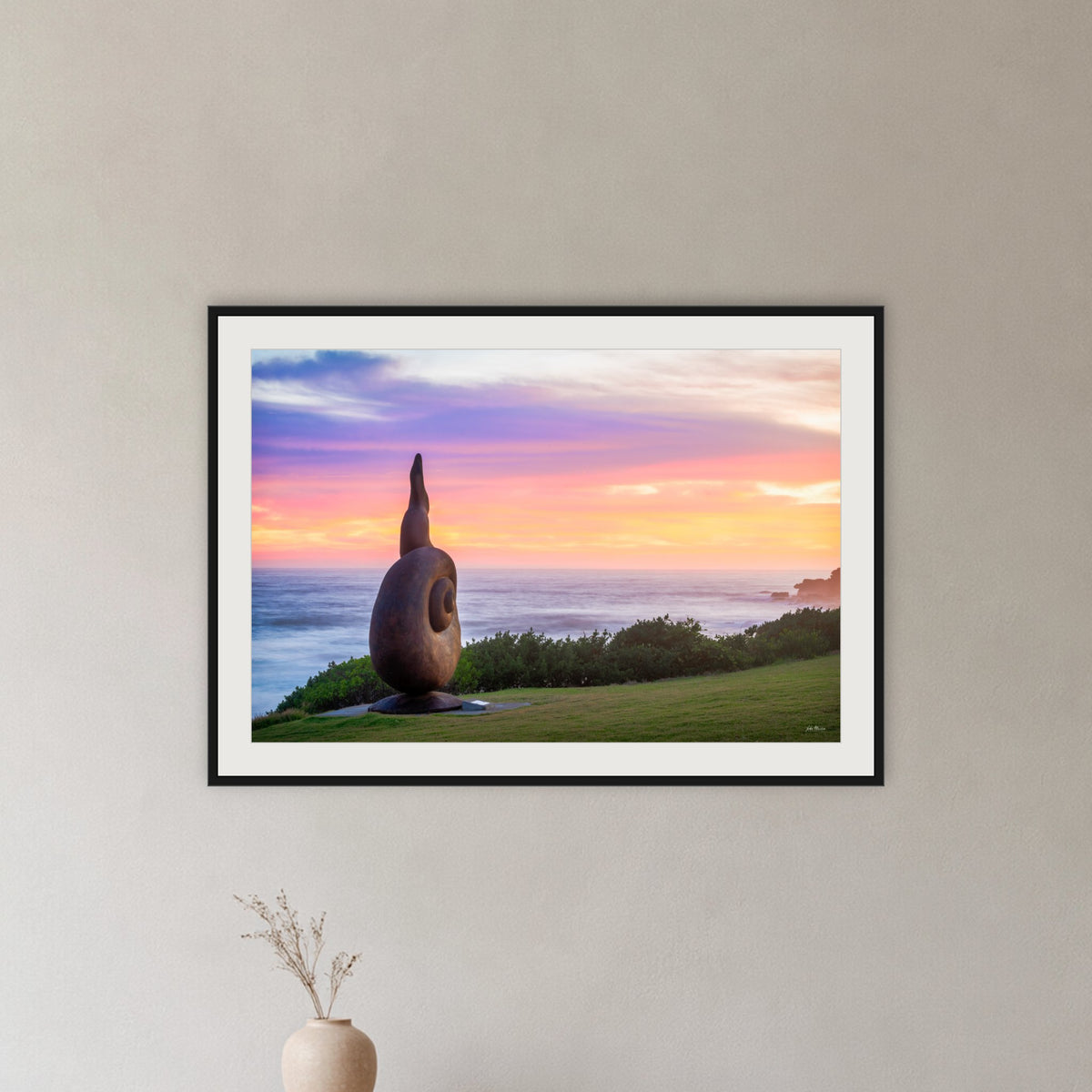 Short Point Sculpture framed print in black with a white mat, in a hallway