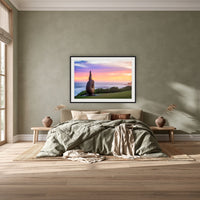 Short Point Sculpture framed print in black with a white mat, above a khaki linen bed against a green-grey wall in a bedroom
