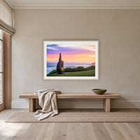 Short Point Sculpture framed print in oak with a white mat, above an oak bench in a hallway
