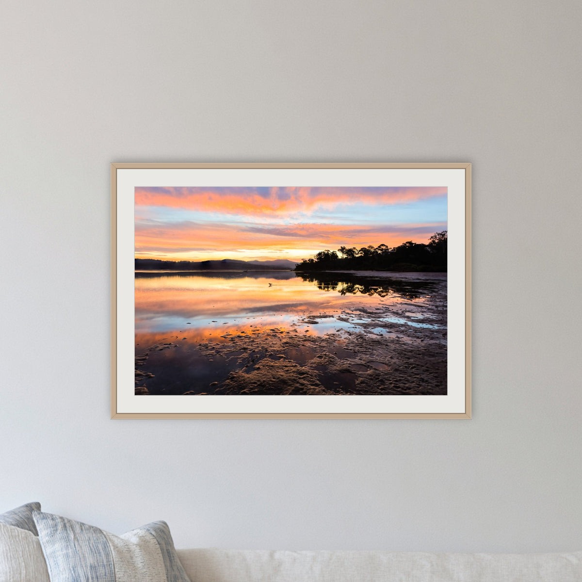 Top Lake Sunset framed print in oak with a white mat, in a lounge room