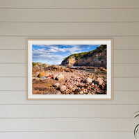 Lennards Island framed print in oak with a white mat, hanging in a coastal lounge room