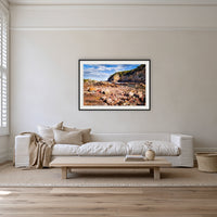 Lennards Island framed print in black with a white mat on a lounge room wall