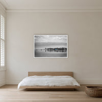 Mitchies Jetty in black and white with colour, in a white frame without a mat, on a bedroom wall