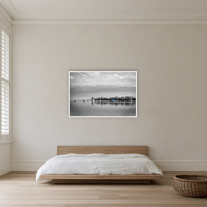 Mitchies Jetty in black and white with colour, in a white frame without a mat, on a bedroom wall