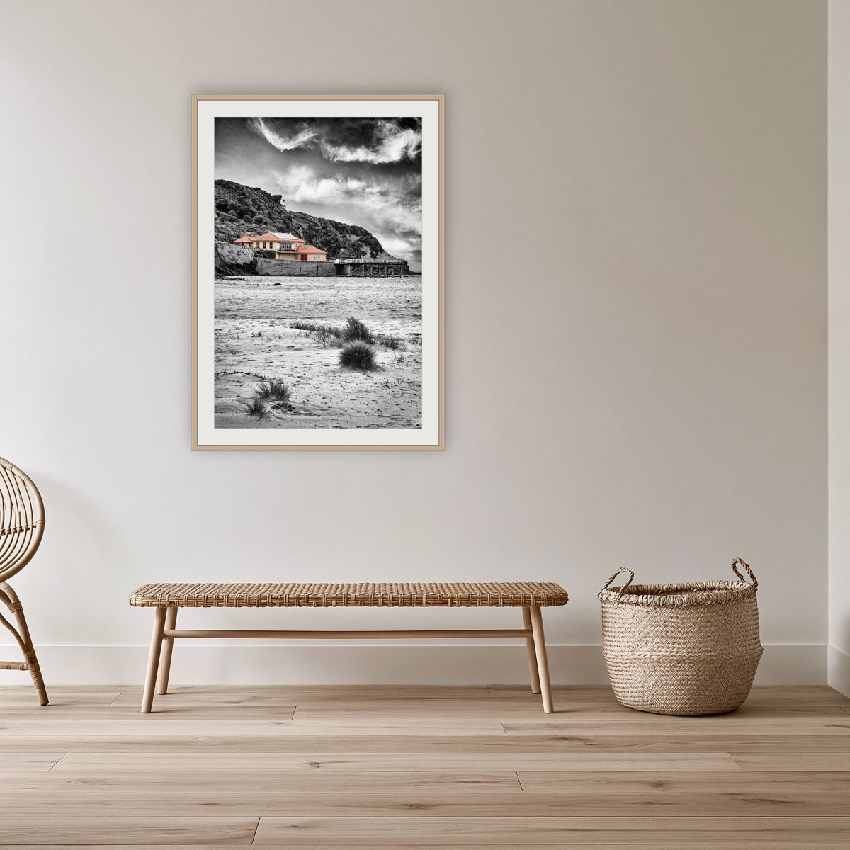 Merimbula Wharf from Main Beach framed print in oak with a white mat, in a cane-panelled hallway