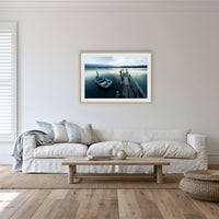 Little Boat at Fishpen Jetty framed print in oak with a white mat, in a lounge room