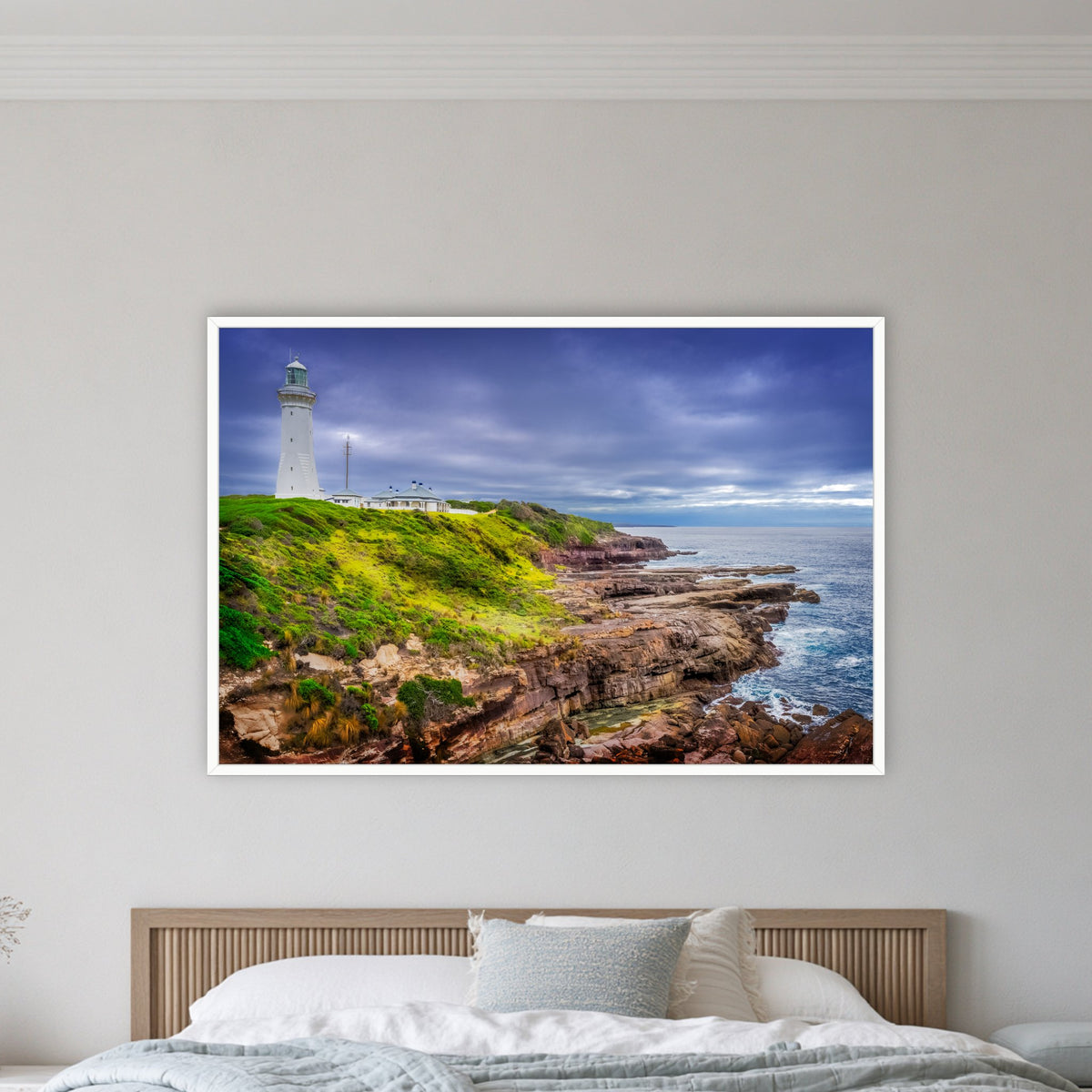 Green Cape Lighthouse in a white frame without a mat, on a coastal bedroom wall