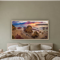 Pambula Beach Sunrise wide panorama in an oak frame above a linen bed on a sage wall — wall art, Sapphire Coast NSW