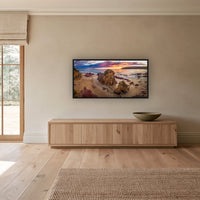 Pambula Beach Sunrise wide panorama in a black frame above a long oak sideboard — wall art, Sapphire Coast NSW