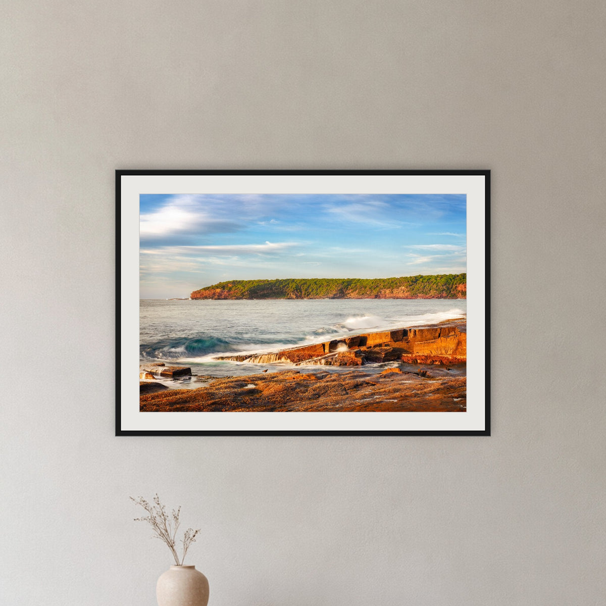 Short Point Sunrise framed print in black with a white mat, in a hallway
