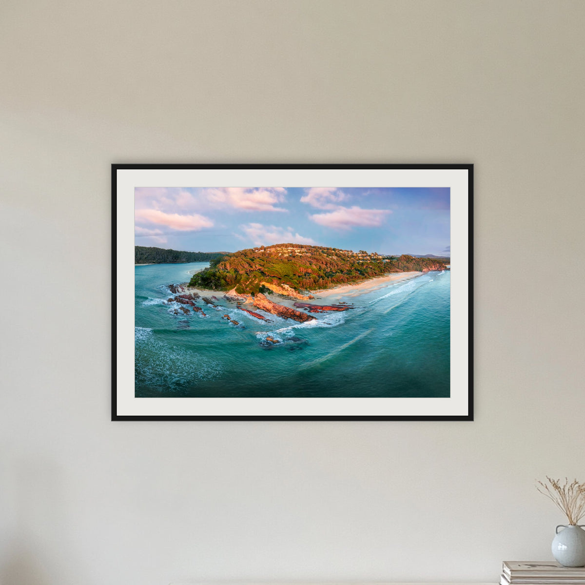 Pambula Beach Seascape framed print in black with a white mat, in a hallway