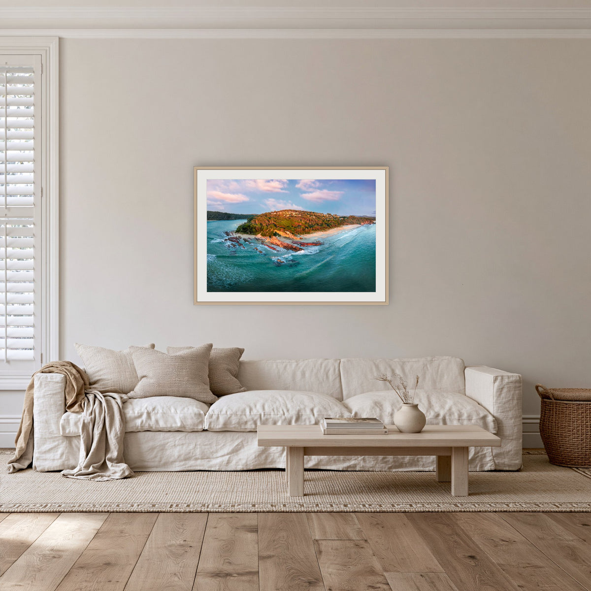 Pambula Beach Seascape framed print in oak with a white mat, in a lounge room