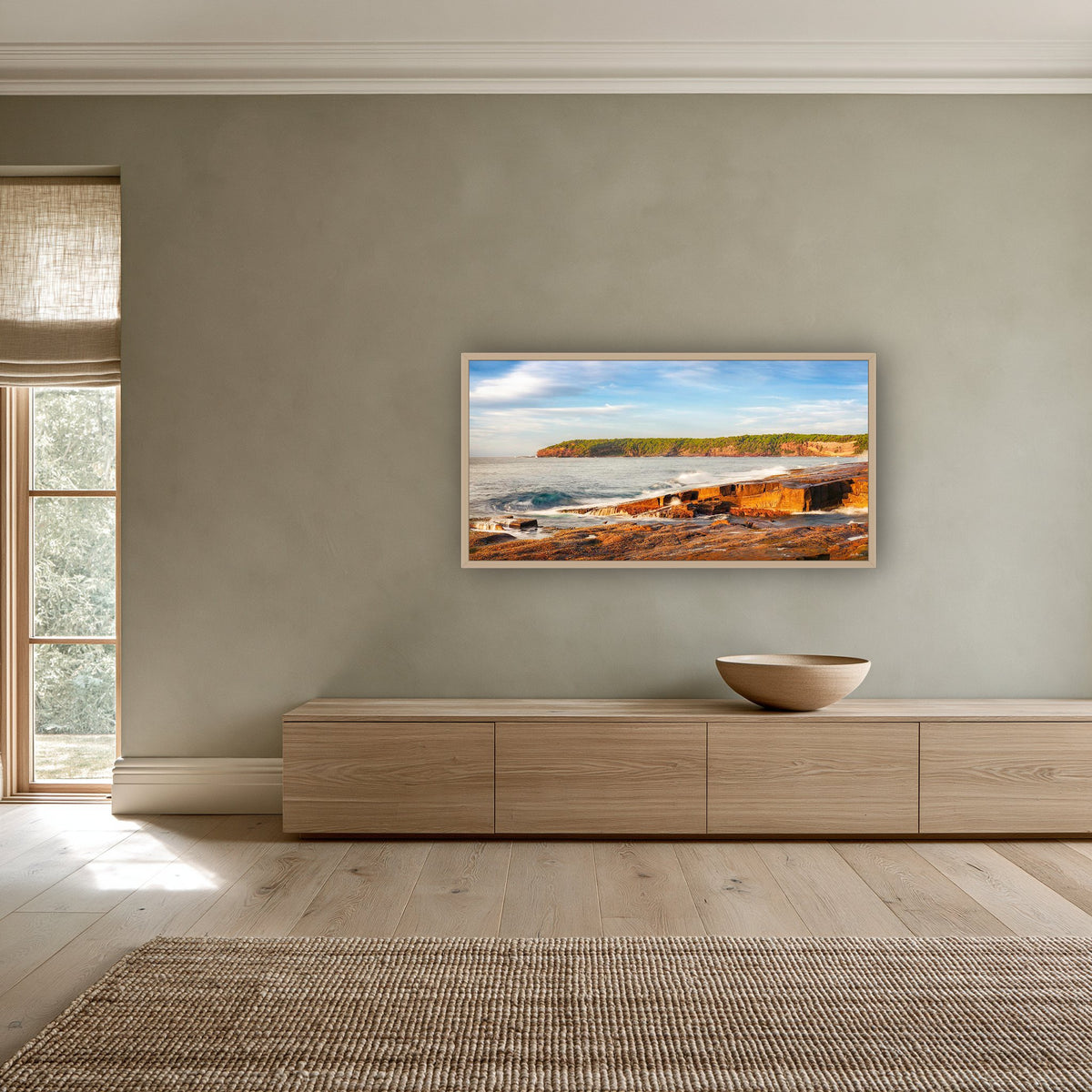 Short Point Sunrise wide panorama in an oak frame above an oak sideboard — wall art, Merimbula NSW