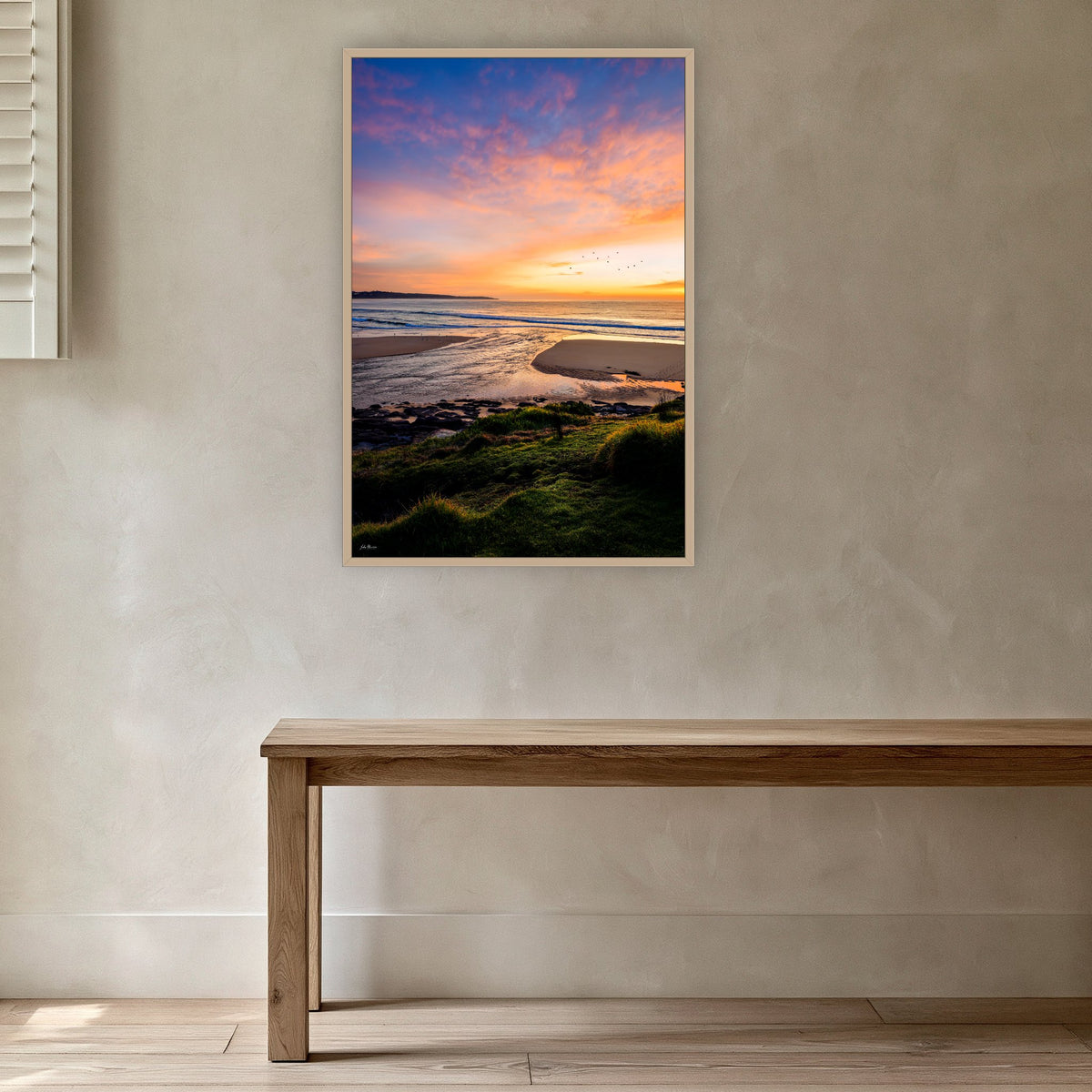 Short Point Back Lake in an oak frame without a mat, in a plaster-walled hallway