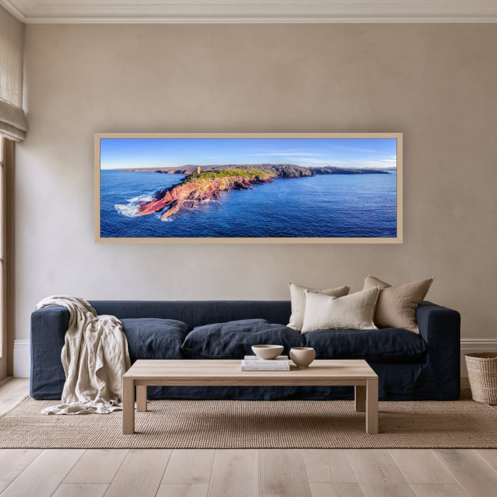 Ben Boyd Tower at Golden Hour super wide panorama in an oak frame above a navy linen sofa — wall art, Eden NSW