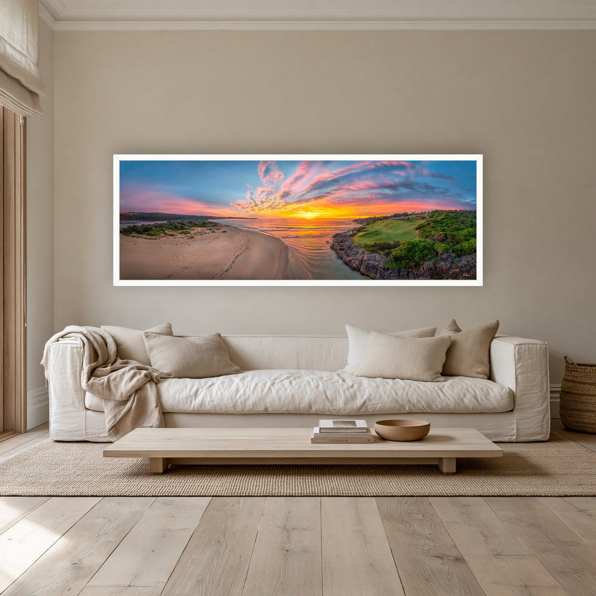 Short Point New Day super wide panorama in a white frame above a cream linen sofa — wall art, Merimbula NSW