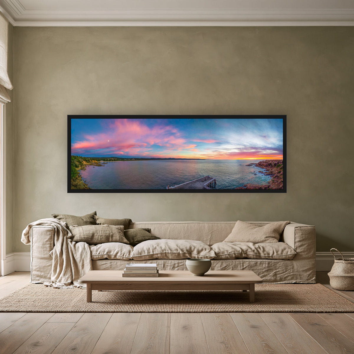 Tathra Sunrise super wide panorama in a black frame above a linen sofa — wall art, Sapphire Coast NSW