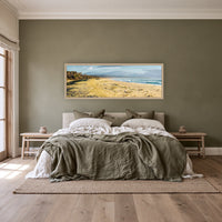 Bournda Beach super wide panorama in an oak frame above a linen bed with an olive throw — wall art, Sapphire Coast NSW