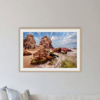 Pambula Rocks framed print in oak with a white mat, in a lounge room