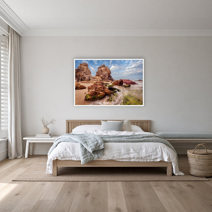 Pambula Rocks in a white frame without a mat, on a coastal bedroom wall